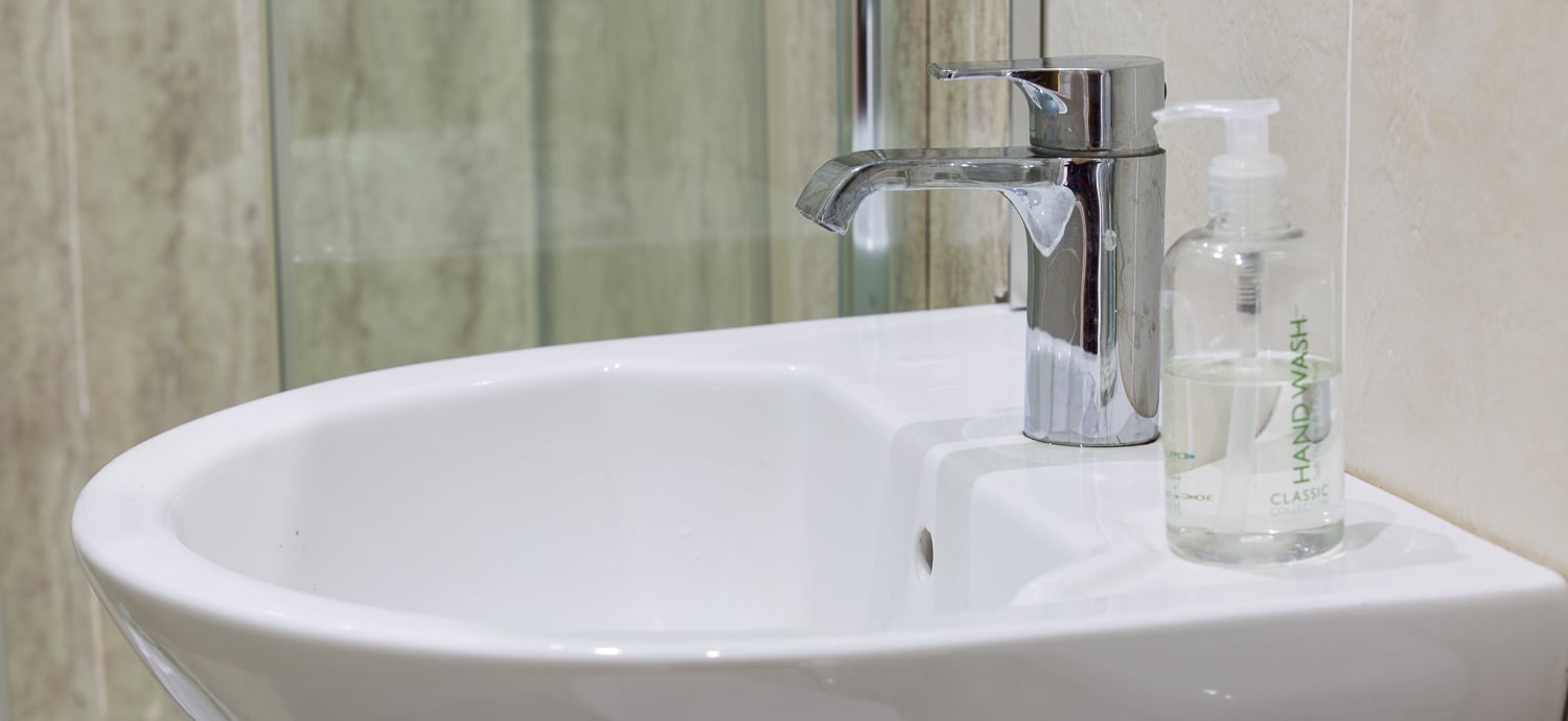 A sink in the bathroom of one of the rooms of The Old Barn